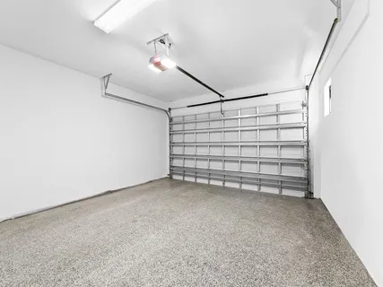 a view of an empty room with a white walls