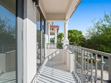 a view of a balcony with wooden floor