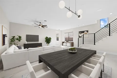 a dining room with furniture and wooden floor