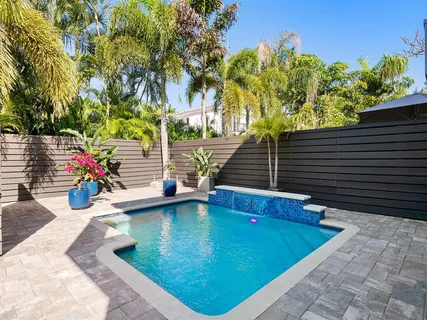a view of swimming pool with seating space