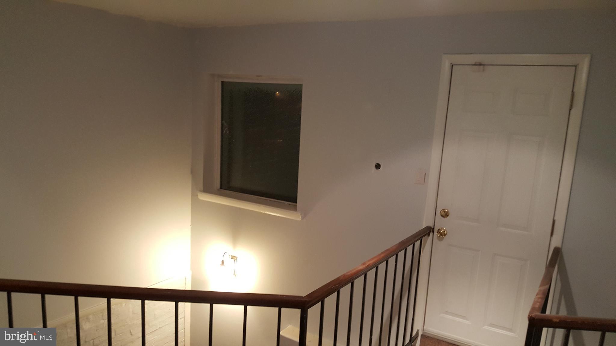 624 Stirling Street Baltimore, MD 21202 - Photo 11 of 27 a view of a hallway