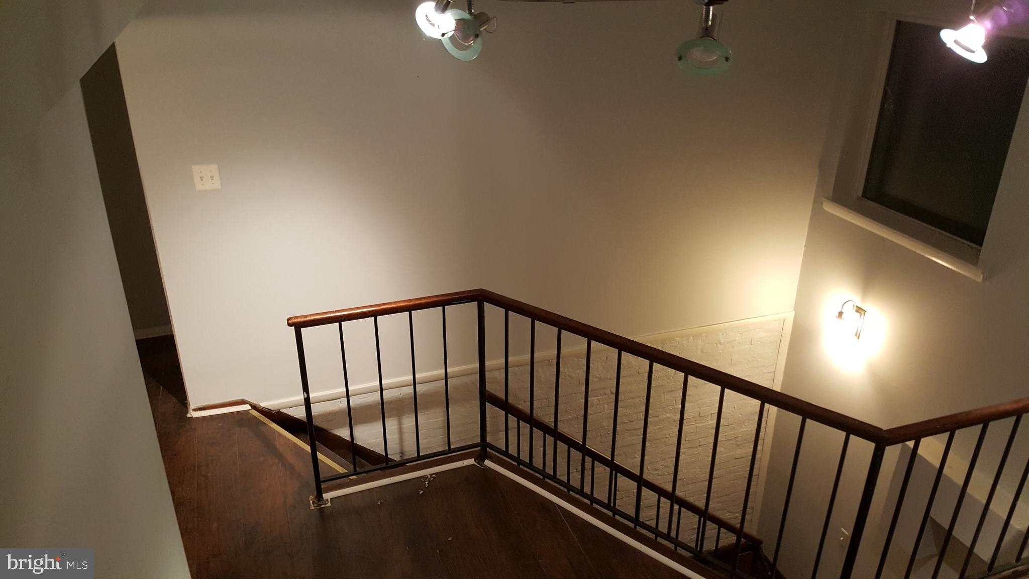 624 Stirling Street Baltimore, MD 21202 - Photo 15 of 27 a view of staircase with rug floor