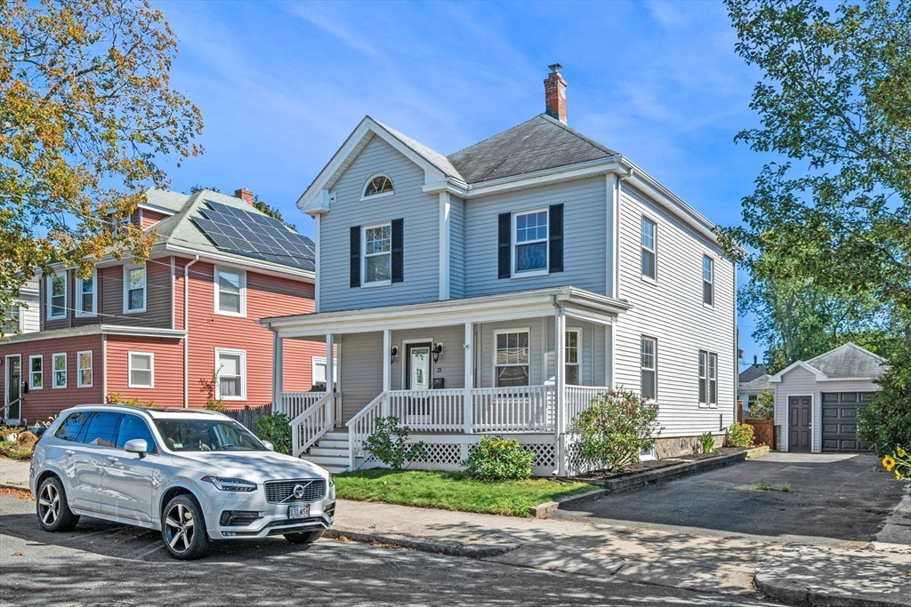 a car parked in front of a house