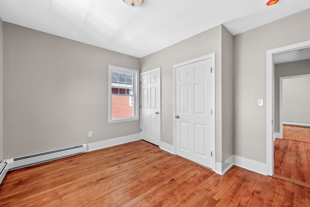 21 Lyman Street Beverly, MA 01915 - Photo 14 of 33 a view of empty room with wooden floor