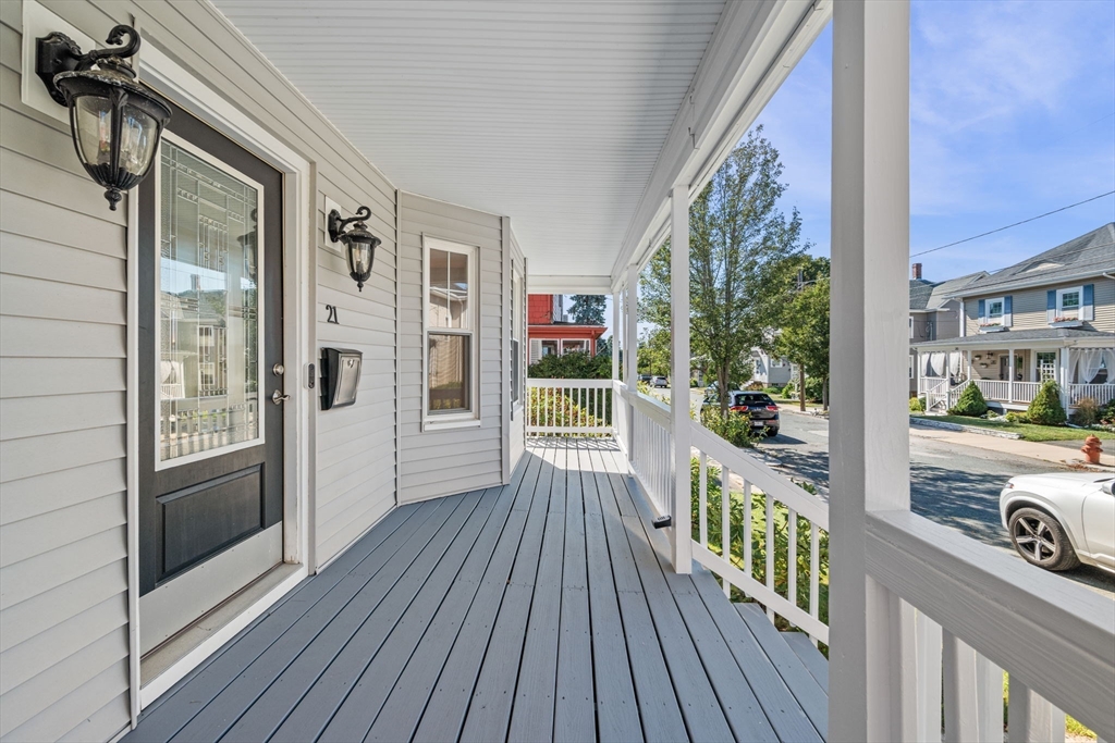 21 Lyman Street Beverly, MA 01915 - Photo 2 of 33 a view of a balcony with wooden floor