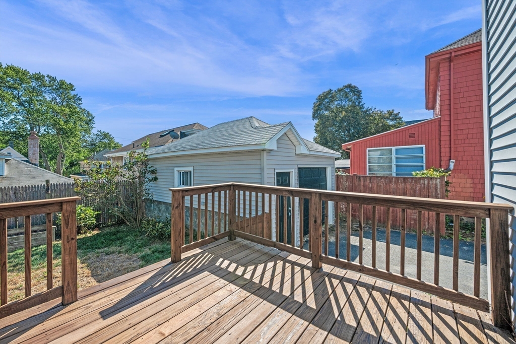21 Lyman Street Beverly, MA 01915 - Photo 25 of 33 a view of balcony with wooden floor and fence