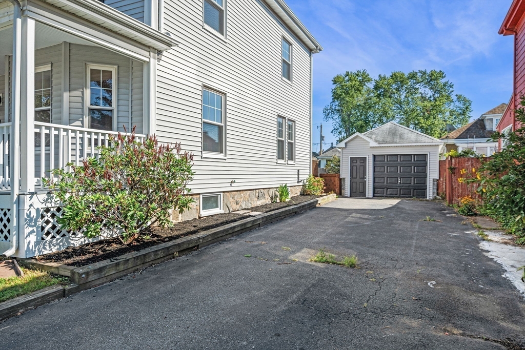 21 Lyman Street Beverly, MA 01915 - Photo 29 of 33 a front view of a house with garden