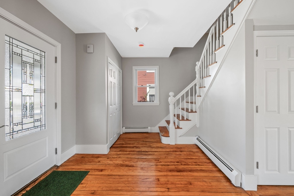 21 Lyman Street Beverly, MA 01915 - Photo 4 of 33 a view of an entryway with wooden floor