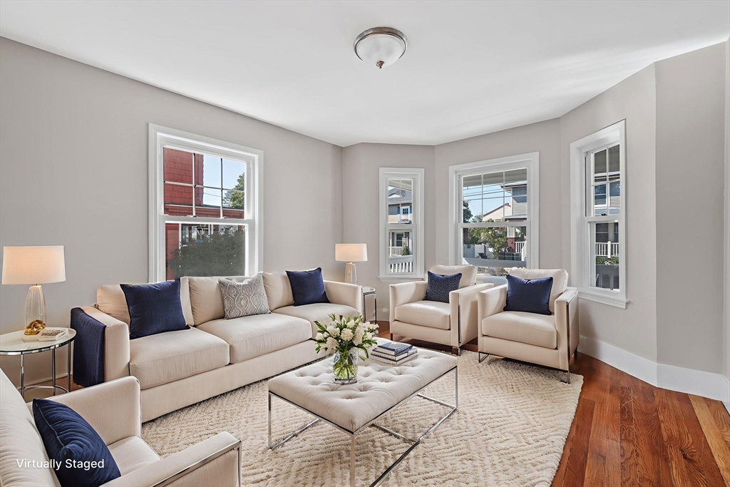 21 Lyman Street Beverly, MA 01915 - Photo 6 of 33 a living room with furniture and a large window