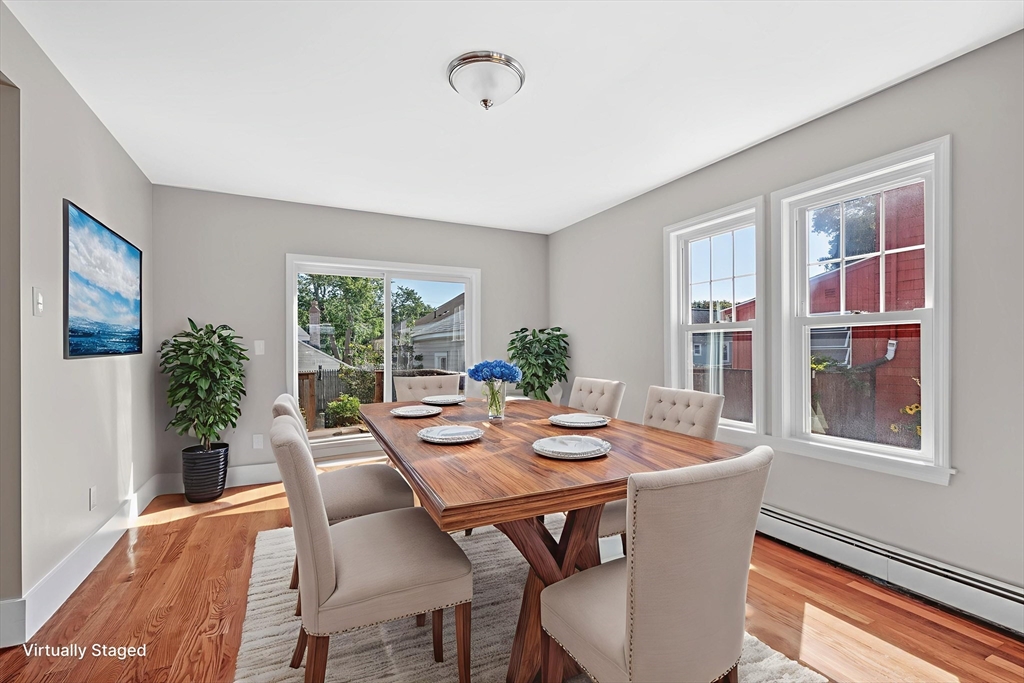 21 Lyman Street Beverly, MA 01915 - Photo 9 of 33 a view of a dining room with furniture window and outside view