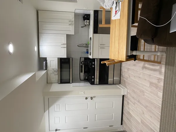 walk in closet with wooden floor