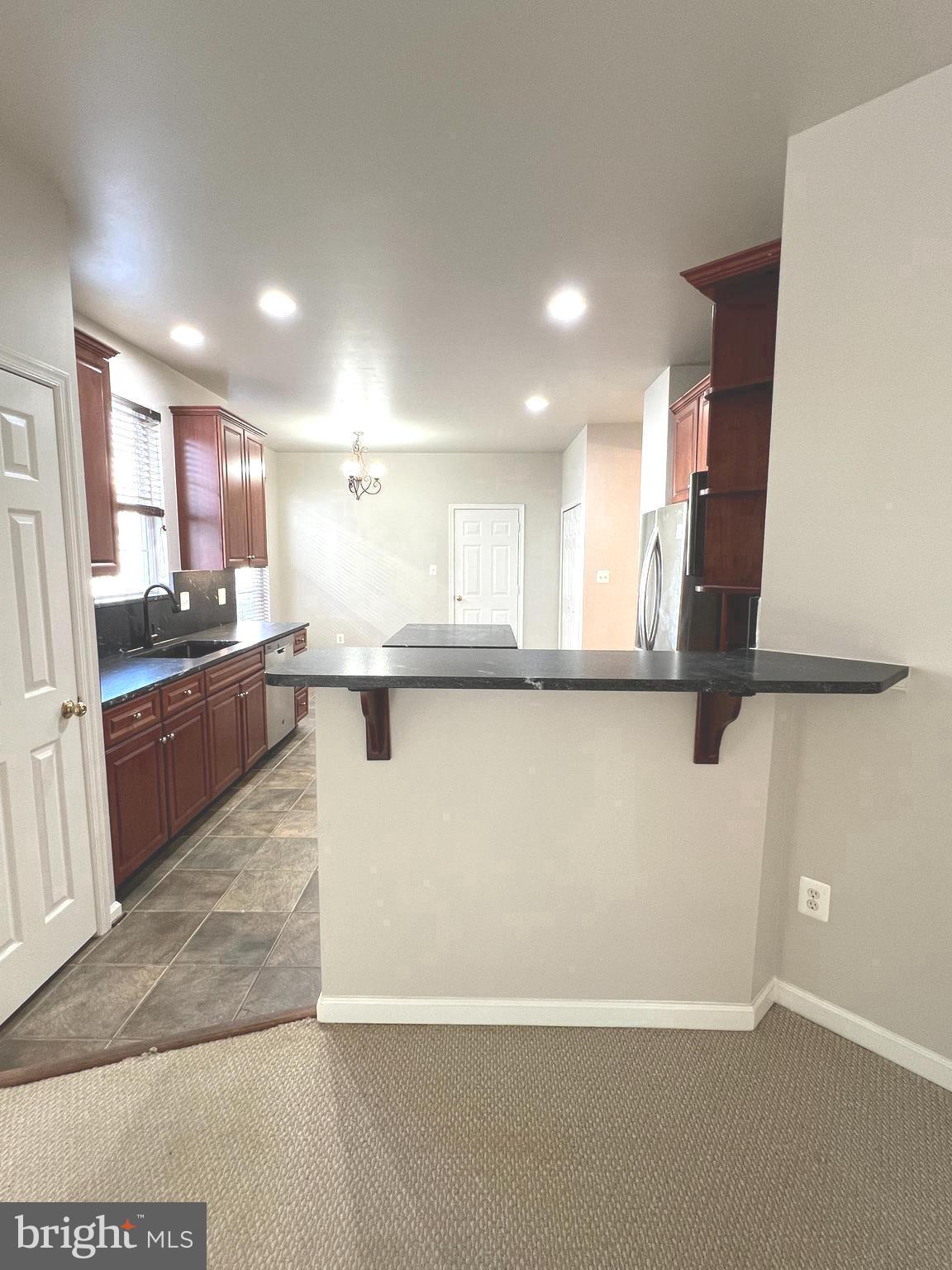 8378 Tillett Loop Manassas, VA 20110 - Photo 7 of 30 Kitchen bar w/room for stools