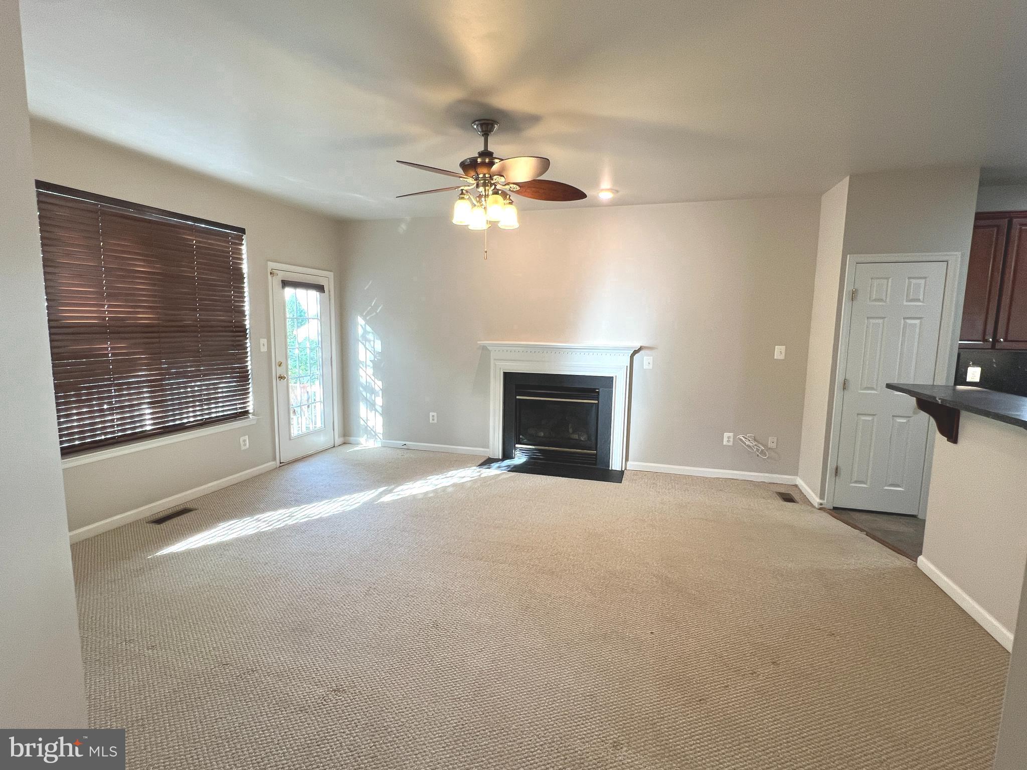 8378 Tillett Loop Manassas, VA 20110 - Photo 10 of 30 Family room w/gas fireplace off kitchen