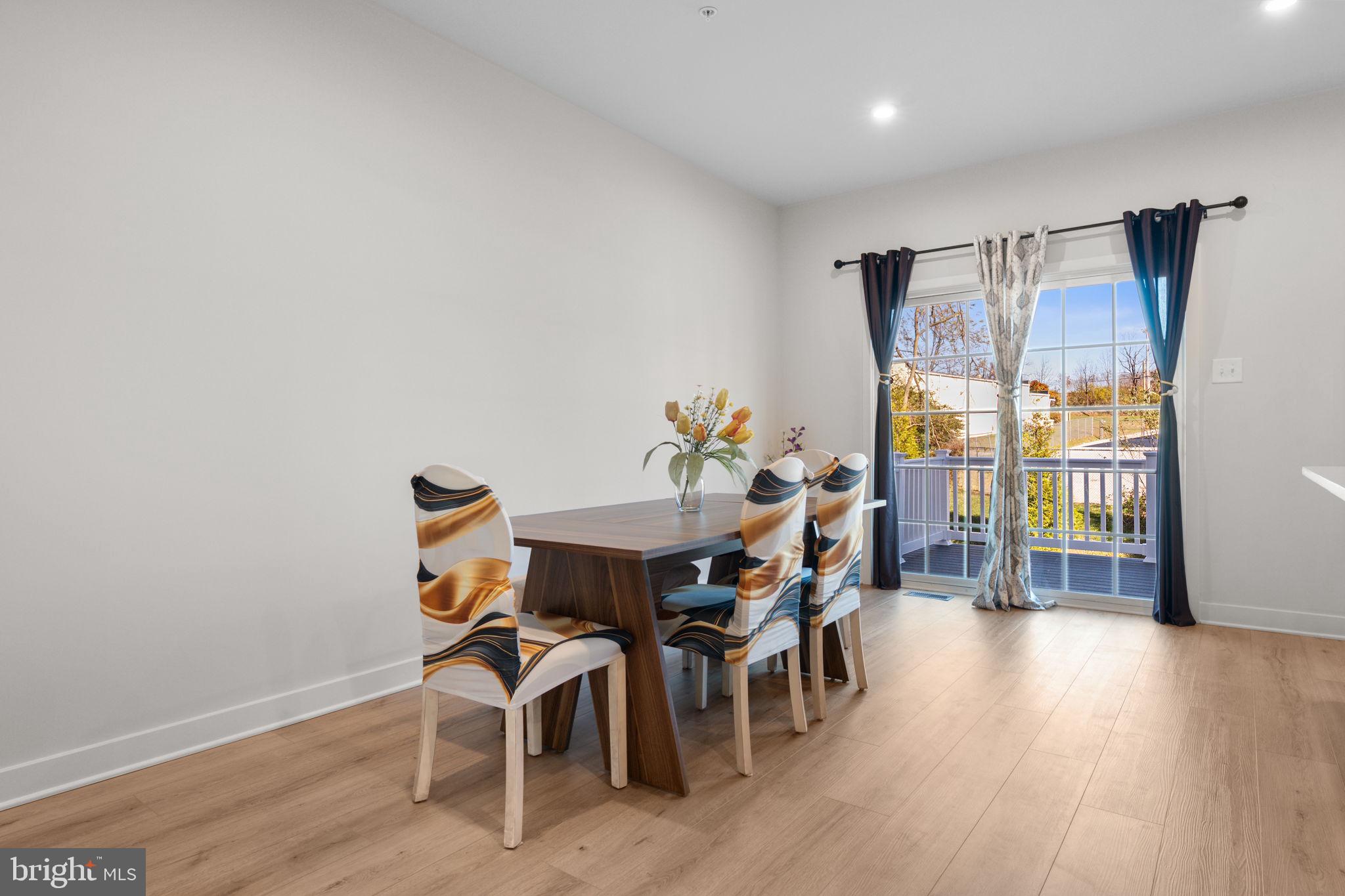 316 Longs Peak Way Exton, PA 19341 - Photo 17 of 46 a view of a dining room with furniture and wooden floor