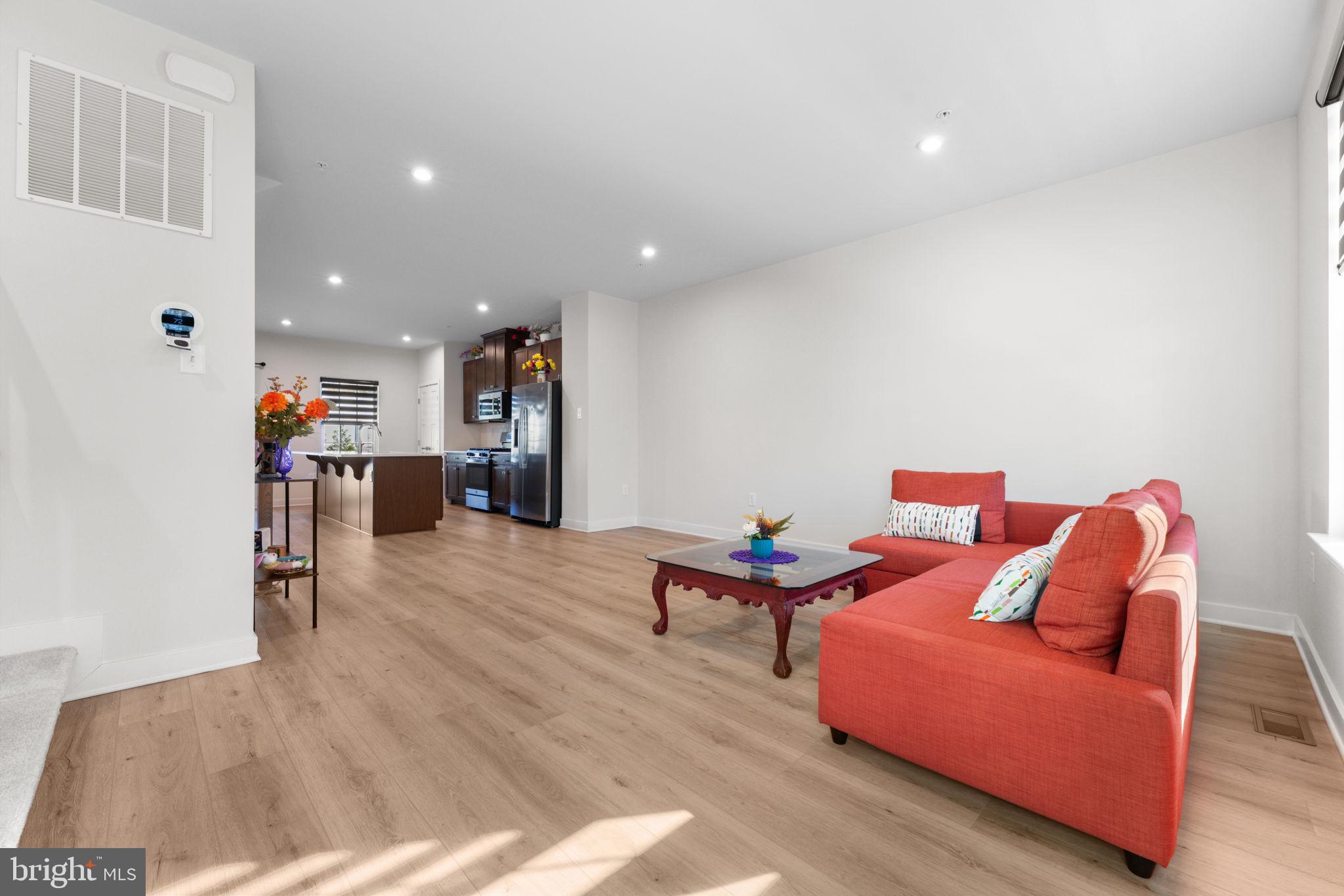 316 Longs Peak Way Exton, PA 19341 - Photo 20 of 46 a living room with furniture and a wooden floor