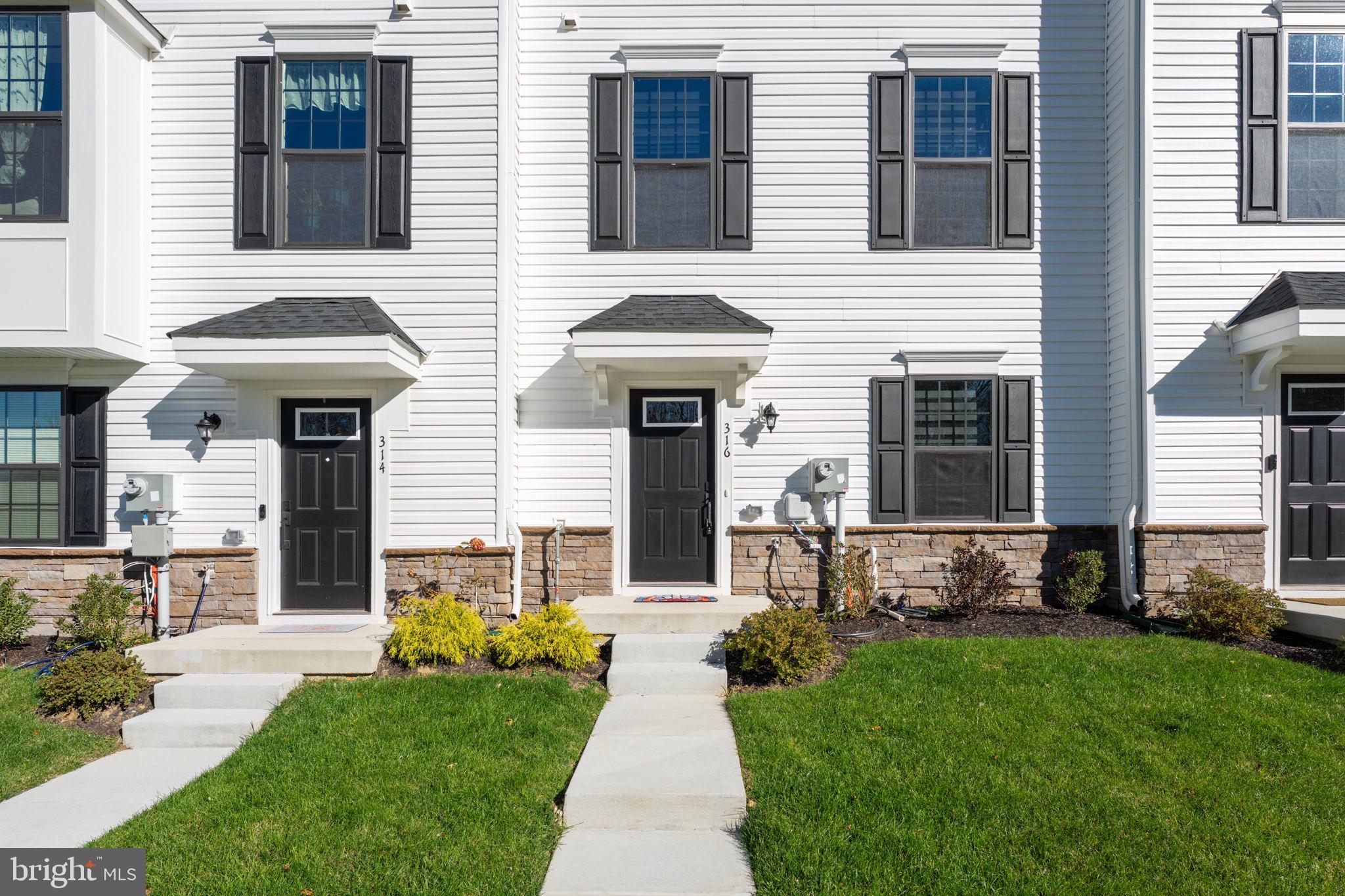 316 Longs Peak Way Exton, PA 19341 - Photo 2 of 46 a front view of a house with garden