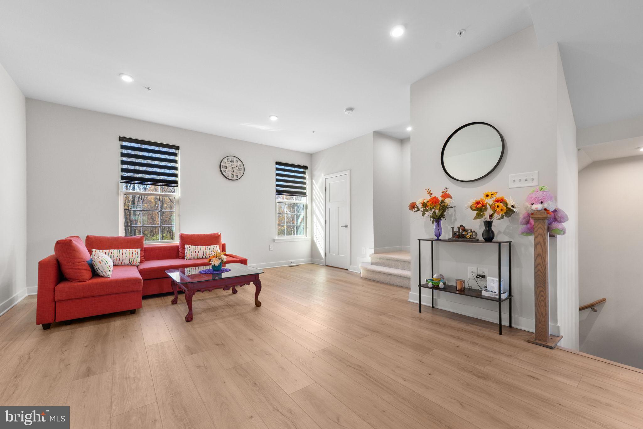 316 Longs Peak Way Exton, PA 19341 - Photo 21 of 46 a living room with furniture and a wooden floor