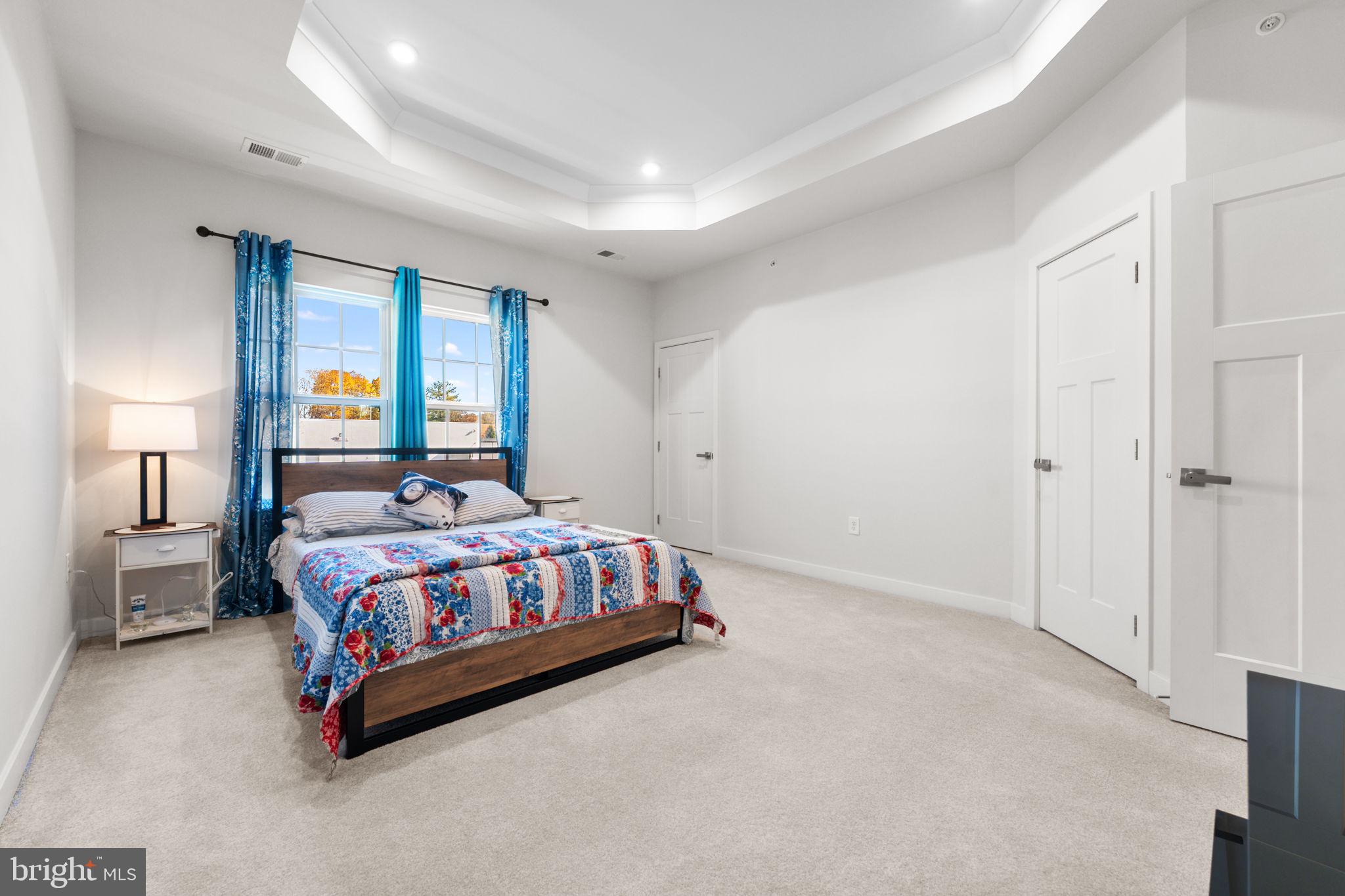 316 Longs Peak Way Exton, PA 19341 - Photo 27 of 46 a bedroom with a bed lamp and window