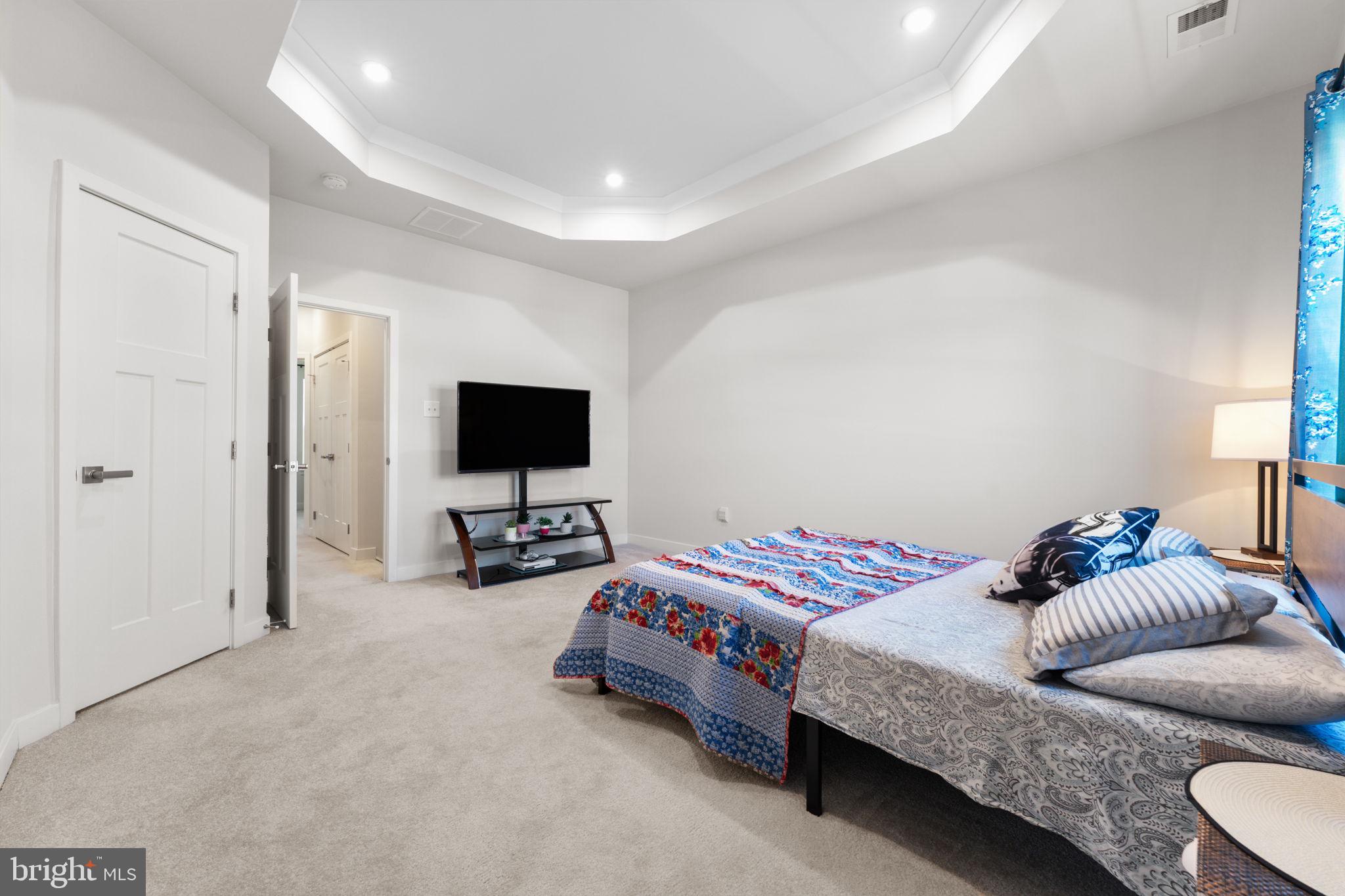 316 Longs Peak Way Exton, PA 19341 - Photo 28 of 46 a bedroom with a bed and a flat screen tv