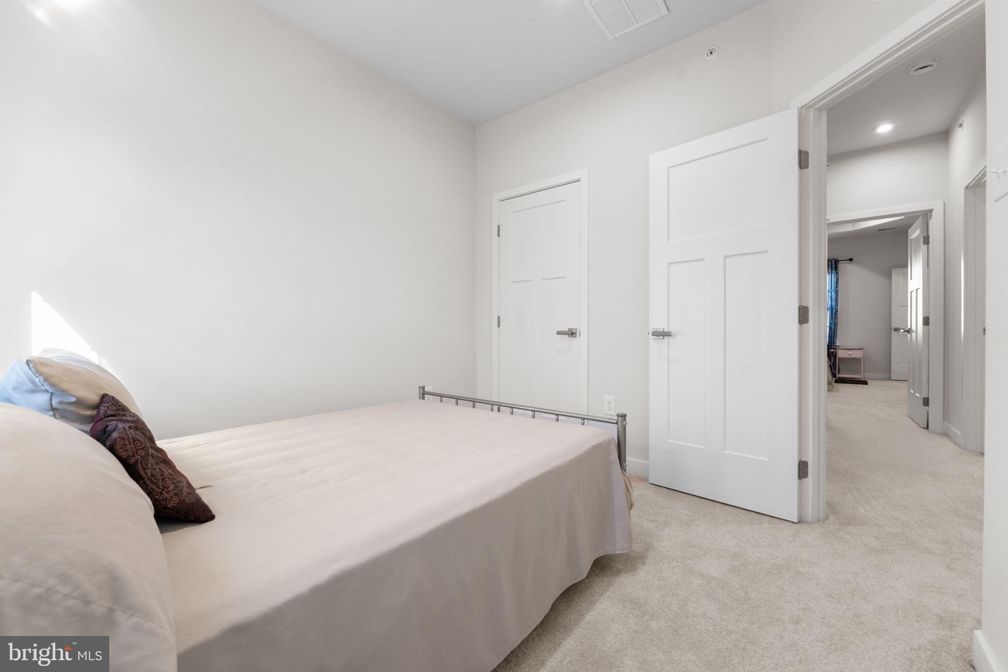 316 Longs Peak Way Exton, PA 19341 - Photo 32 of 46 a spacious bedroom with a bed and a shower