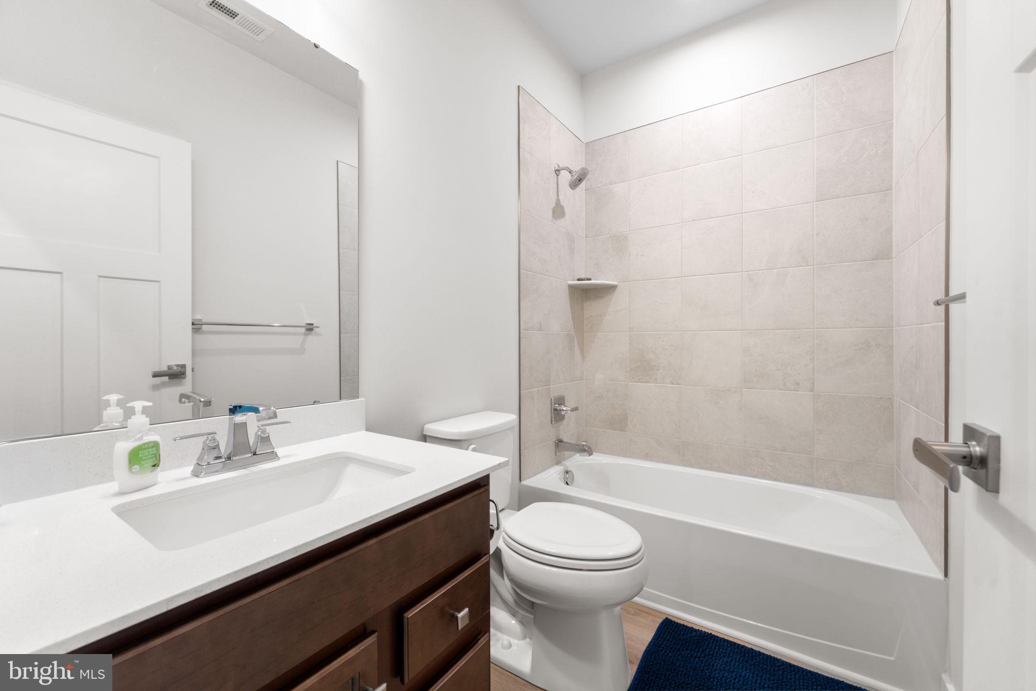 316 Longs Peak Way Exton, PA 19341 - Photo 34 of 46 a bathroom with a sink a toilet and a bathtub