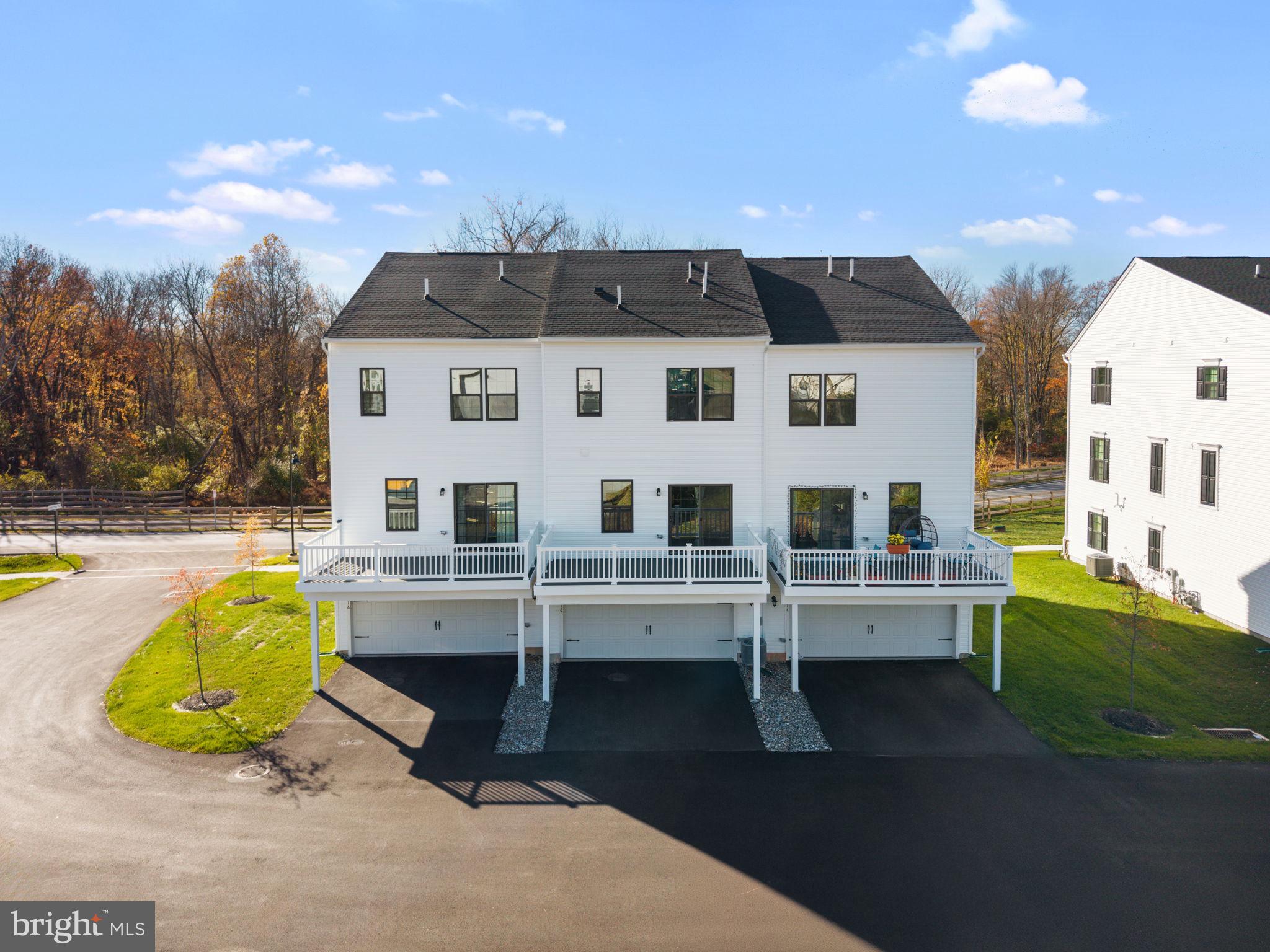 316 Longs Peak Way Exton, PA 19341 - Photo 4 of 46 a view of a white house with a swimming pool in front of it