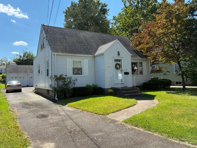 a view of a house with sitting area and furniture