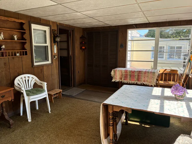 a view of a dining room with furniture window and outside view
