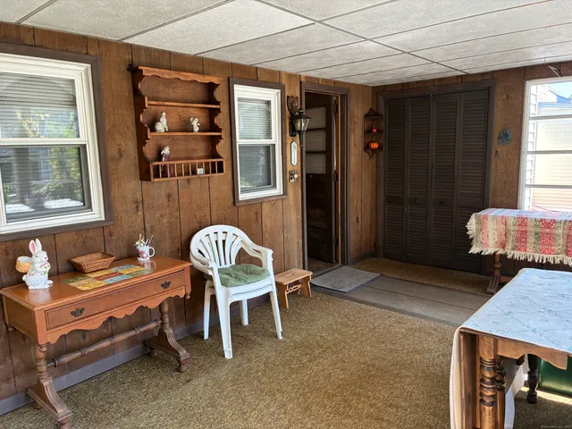 a dining room with furniture and window