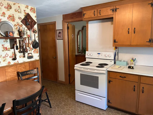 a kitchen with a stove and a refrigerator