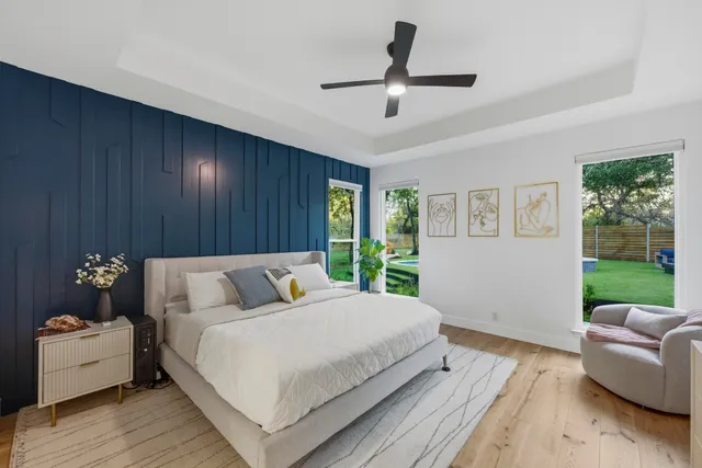 a bedroom with a bed and a couch