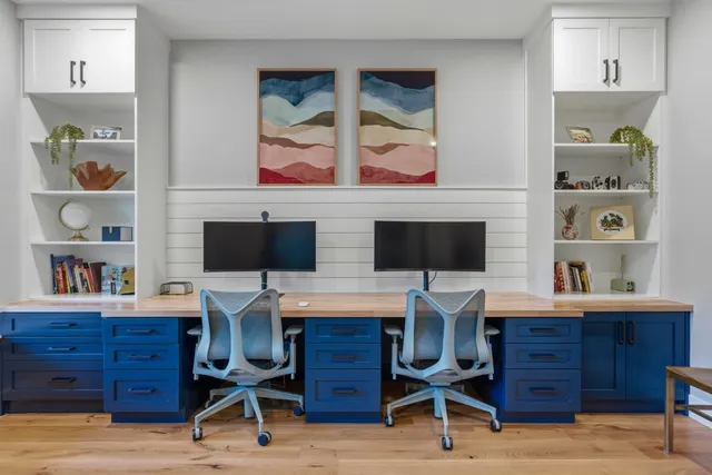 a view of a workspace with furniture