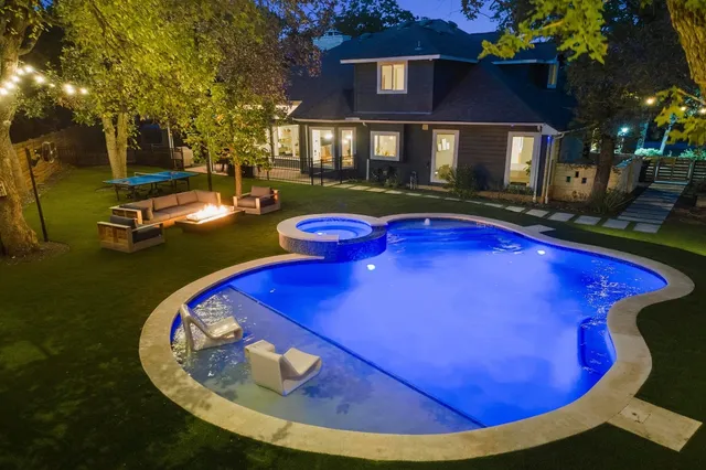 a view of a swimming pool with chairs