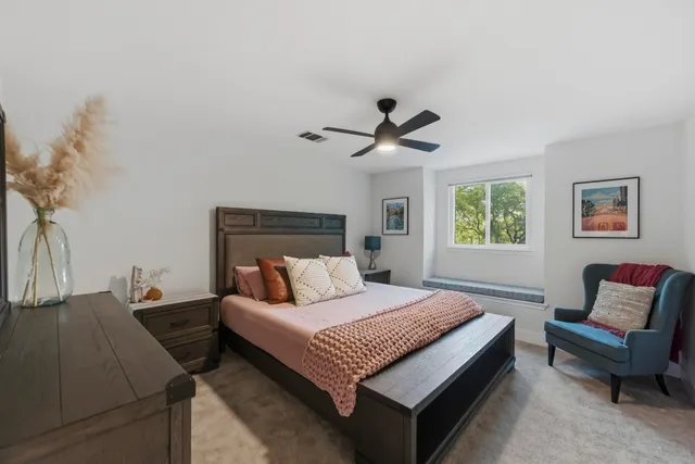 a bedroom with a bed and a couch