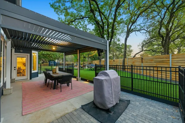 a patio view with a table and chairs