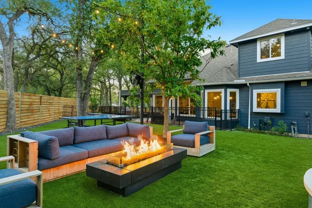 a view of a patio with couches and a big yard