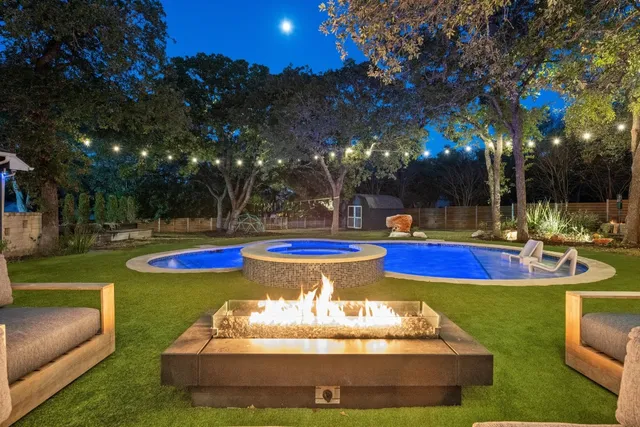 a view of a swimming pool with an outdoor seating