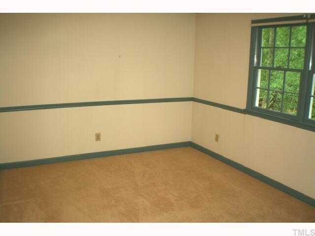 5015 Wickham Road Raleigh, NC 27606 - Photo 12 of 12 a view of a big room with wooden floor