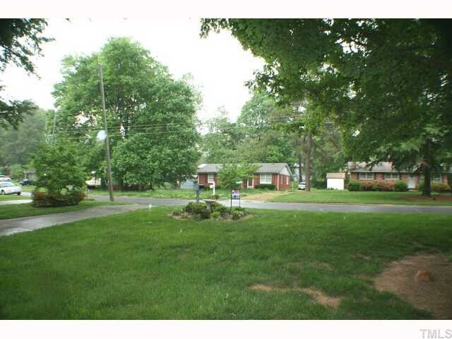 5015 Wickham Road Raleigh, NC 27606 - Photo 5 of 12 a front view of a house with a garden