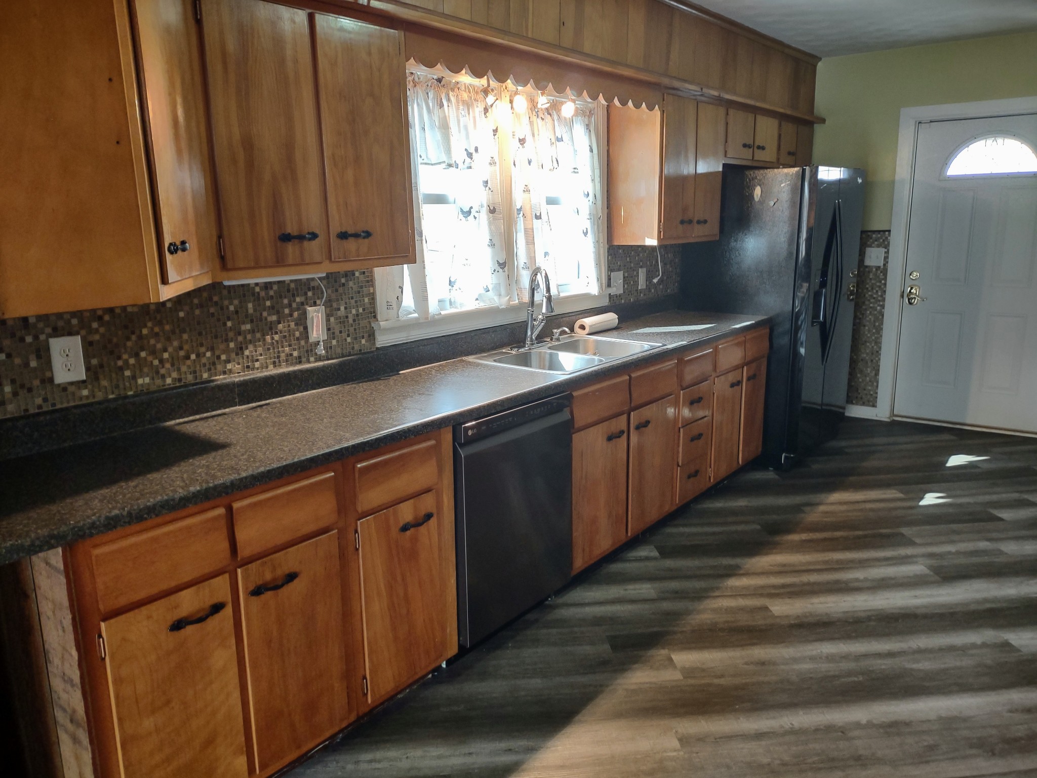 320 Connell Street Springfield, TN 37172 - Photo 7 of 12 a kitchen with stainless steel appliances granite countertop a sink stove and refrigerator
