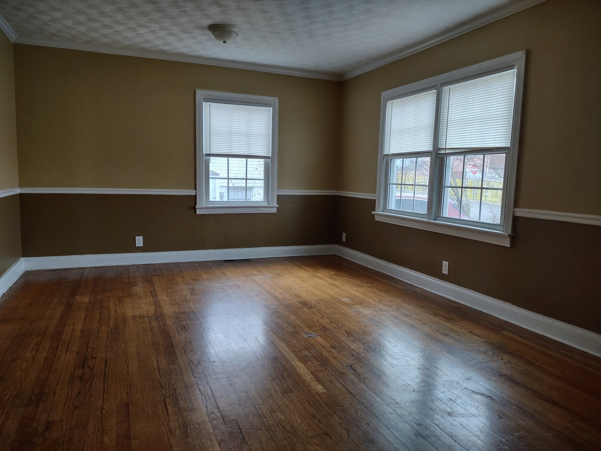 320 Connell Street Springfield, TN 37172 - Photo 8 of 12 an empty room with wooden floor and windows