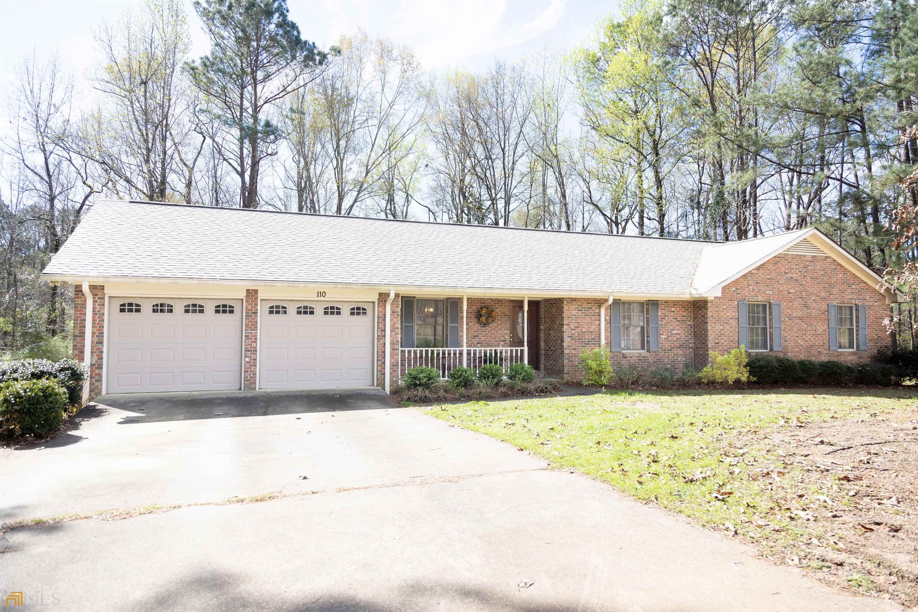 110 Rebel Road Valley, AL 36854 - Photo 1 of 1 a front view of a house with a yard and garage