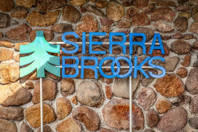 a blue and white curtain sitting next to a blue wall