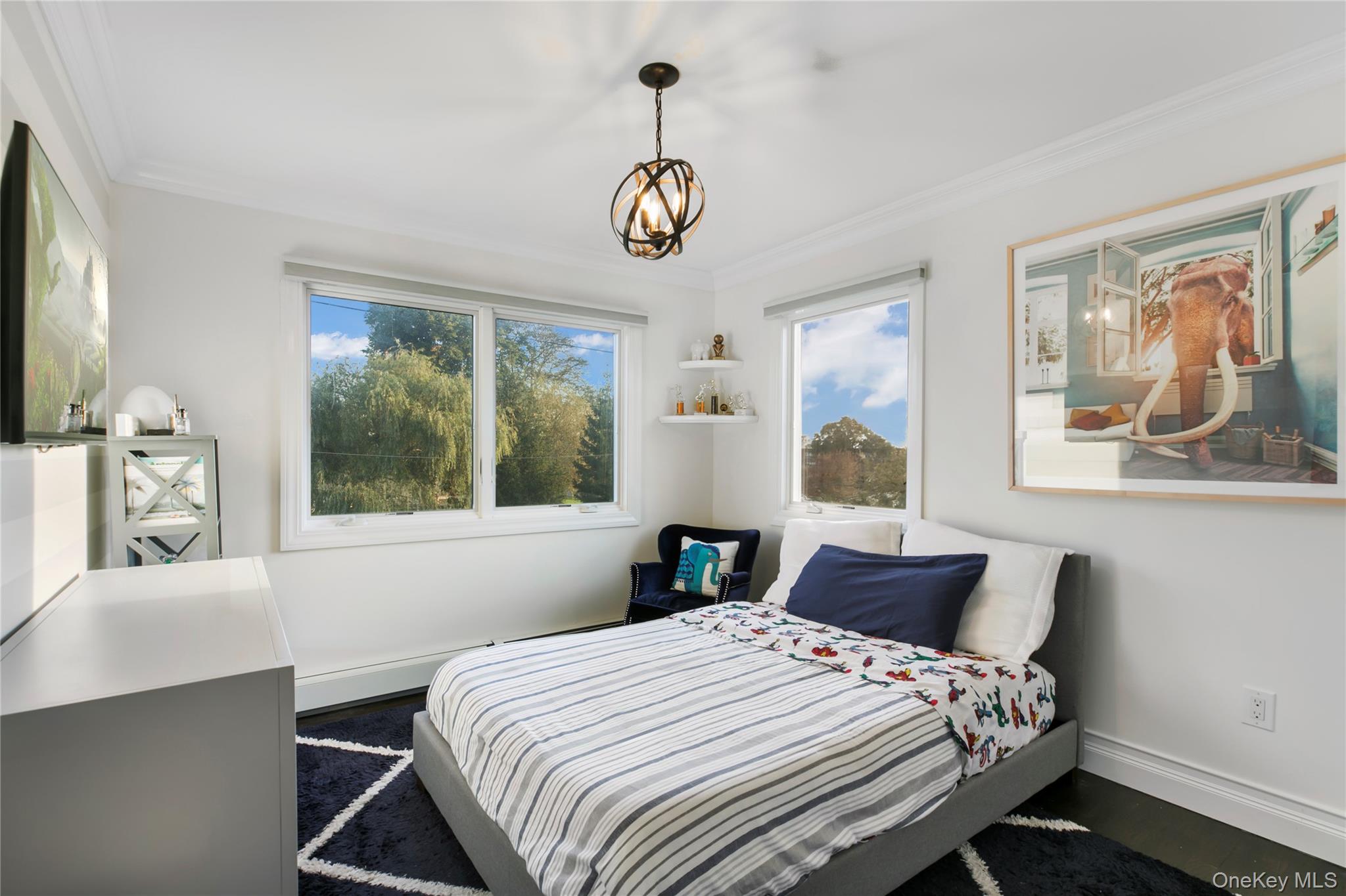 1945 Byron Road Merrick, NY 11566 - Photo 11 of 17 a bedroom with a bed and a window