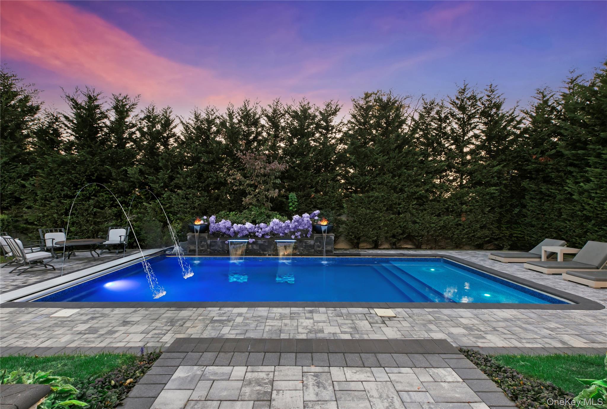 1945 Byron Road Merrick, NY 11566 - Photo 14 of 17 a view of backyard with swimming pool and outdoor seating