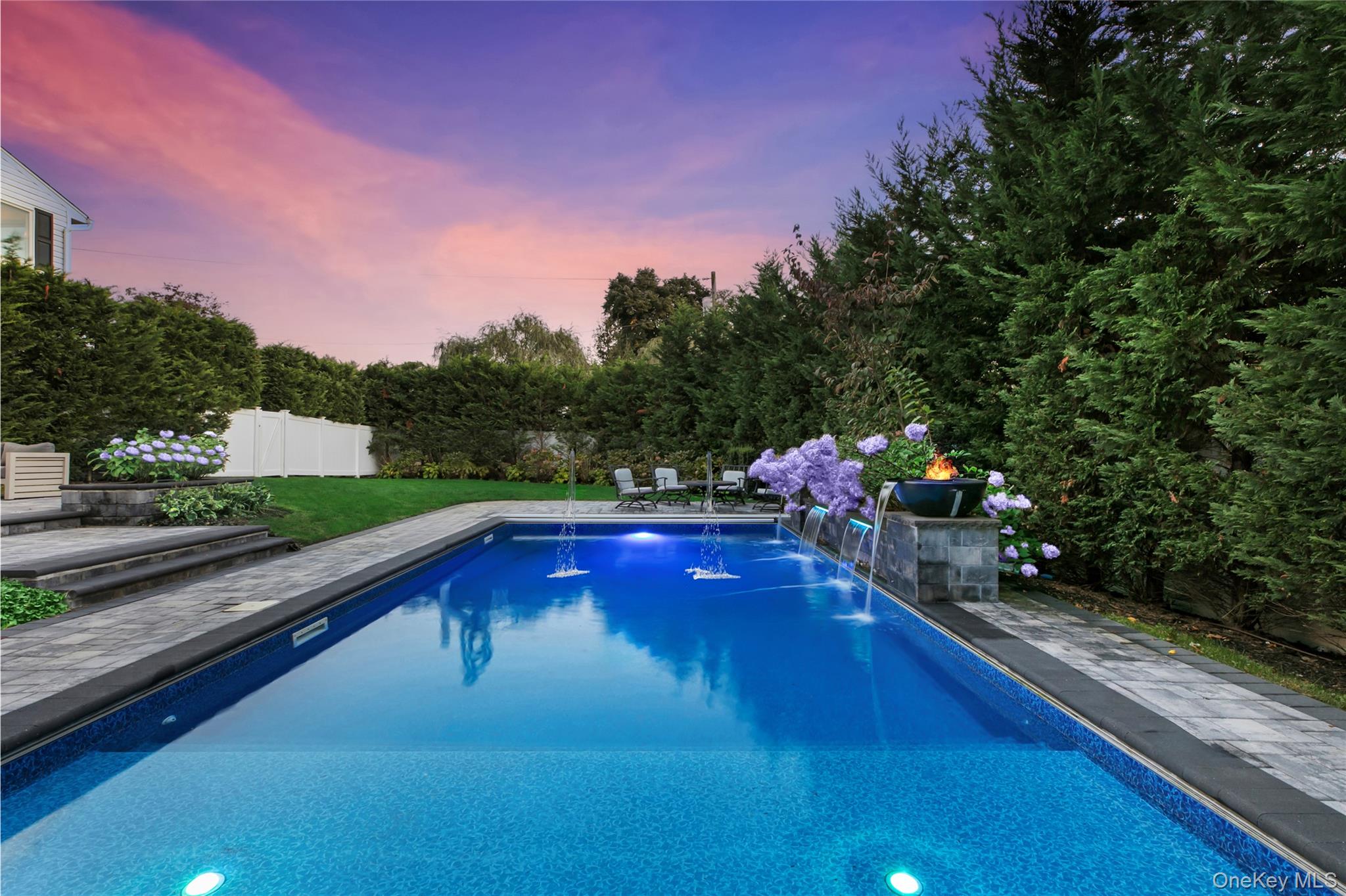 1945 Byron Road Merrick, NY 11566 - Photo 17 of 17 a swimming pool view with a seating space