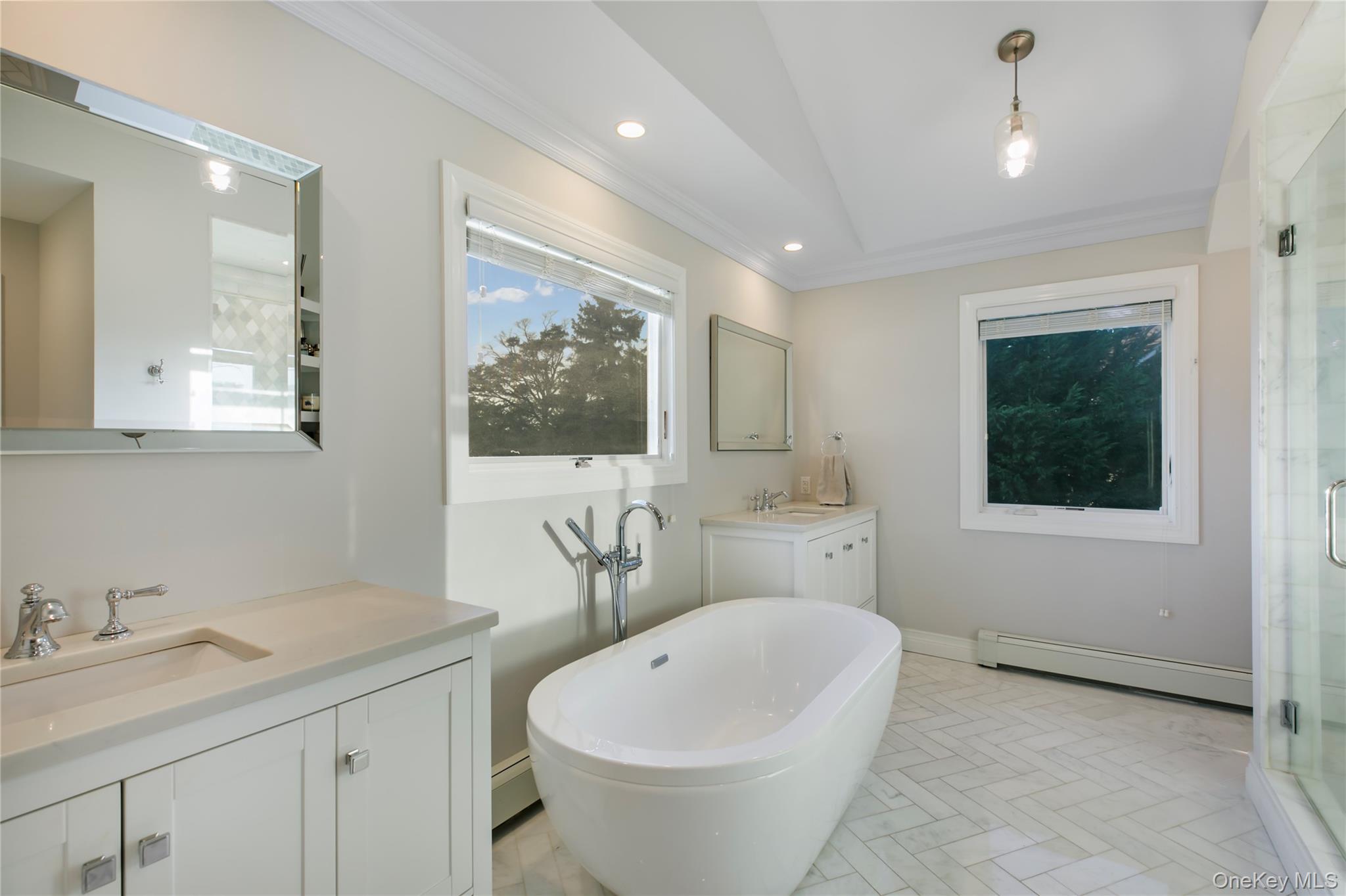 1945 Byron Road Merrick, NY 11566 - Photo 9 of 17 a bathroom with a toilet a sink and mirror