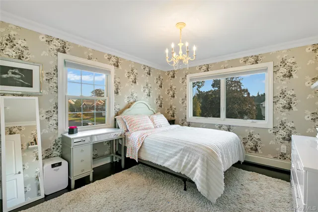 a bed room with a bed and a window