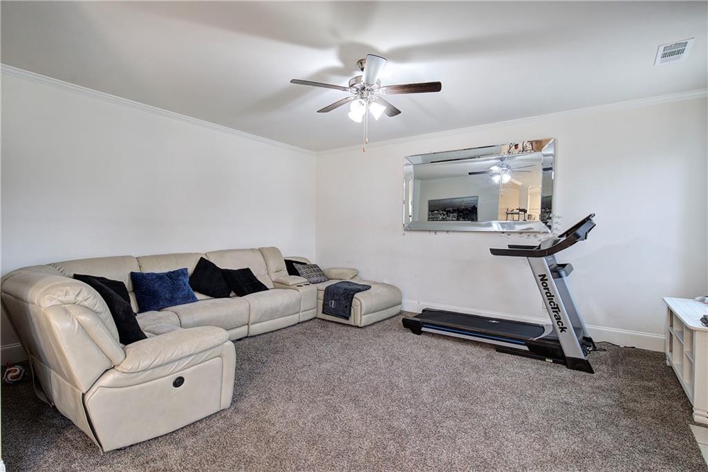 218 Orchard Trail Canton, GA 30115 - Photo 13 of 39 a living room with furniture and a ceiling fan
