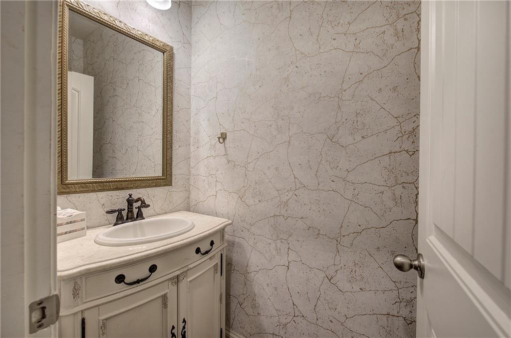 218 Orchard Trail Canton, GA 30115 - Photo 15 of 39 a bathroom with a sink and a mirror